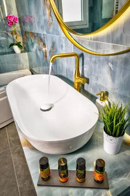 a bathroom with a white sink and a mirror at Casa Veneziana in Chania Town