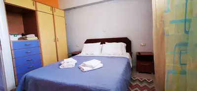 a bedroom with a bed with towels on it at Elia Guesthouse - Kissamos in Kissamos