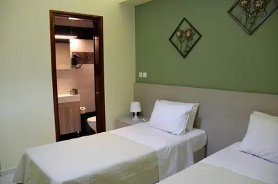 a hotel room with two beds and a mirror at Your Home in Kato Daratso