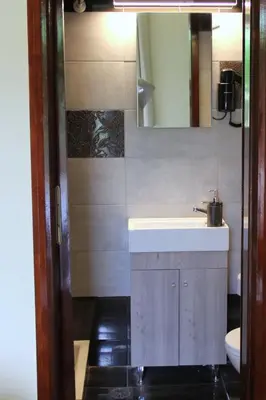 a bathroom with a sink and a mirror at Your Home in Kato Daratso