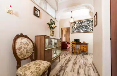 a living room with a chair and a cabinet at Villa Stefania - with Sea View Terrace in Drapaniás