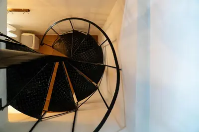 a spiral staircase in a room at Arhondiko in Sougia