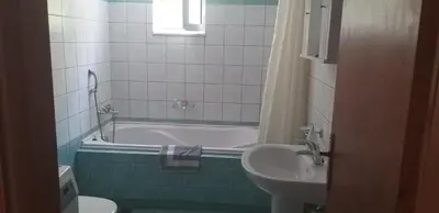 a bathroom with a tub and a sink and a toilet at Cactus in Nopíyia