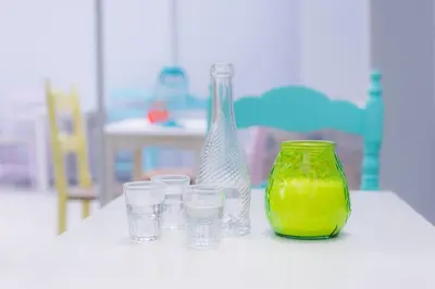 a white table with a vase and glasses on it at Stellar Apartments II in Plataniás