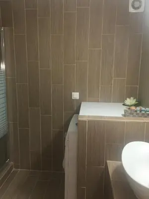 a bathroom with a sink and a toilet at Maria's Garden in Galatás