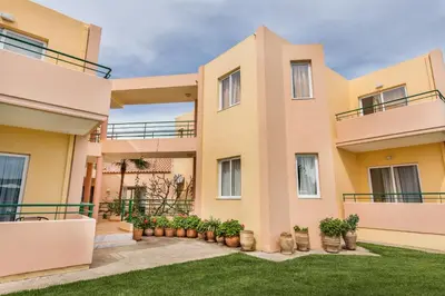 an exterior view of a house with plants at Alonia Hotel Apartments in Kolymvari