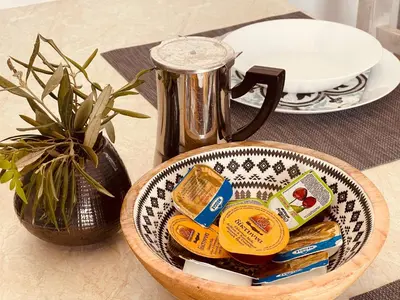 a bowl of food on a table with a tea pot at Brina's House in Kissamos
