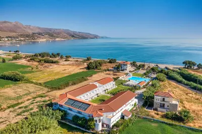 an aerial view of a house and the ocean at Mrs Chryssana Beach Hotel in Kolymvari