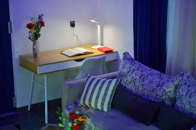 a desk with a couch next to a desk with a book at Villa Zafyra in Kissamos