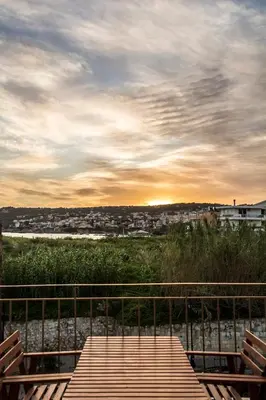 a wooden deck with a view of a city at Elvie House in Chania Town