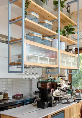 a kitchen with a counter with pots and pans at Porto Kalyves Seaside Aparthotel in Kalyves