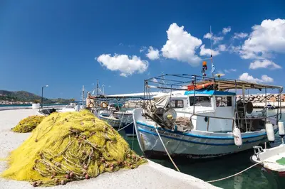 a group of boats docked in the water at Porto Kalyves Seaside Aparthotel in Kalyves