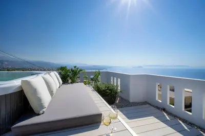 a balcony with a view of the ocean at Rooftop Jacuzzi Apartment in Chania Town