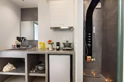 a kitchen with a sink and a counter top at Solar Apartments by Amara Living in Agia Marina Nea Kydonias