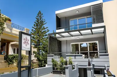 a house with a sign in front of it at Solar Apartments by Amara Living in Agia Marina Nea Kydonias