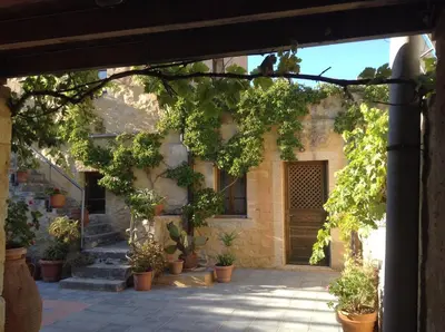 an entrance to a house with potted plants at Villa Alexandrou in Vamos