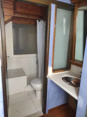 a bathroom with a toilet and a sink at Villa Alexandrou in Vamos