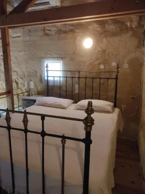 a bedroom with a large bed in a room at Villa Alexandrou in Vamos