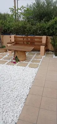 a bench sitting on top of a pile of rocks at Antony Home in Kounoupidhianá