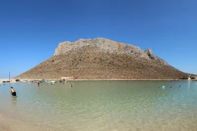 a group of people in the water at a beach at Antony Home in Kounoupidhianá