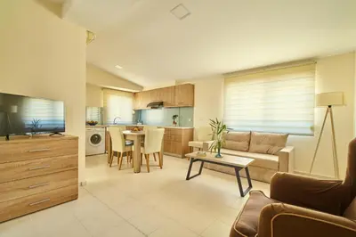 a living room with a couch and a table at Veronica Hotel in Kato Daratso