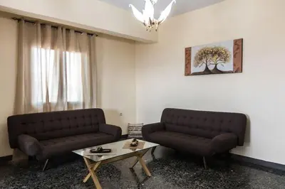 a living room with two couches and a coffee table at Stalos View in Stalos