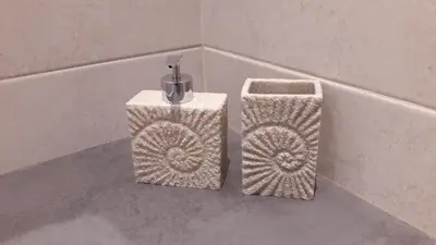 two baskets sitting on the side of a bath tub at Casa Bella Deluxe Apartments in Palaiochóra