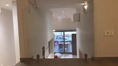 a hallway with a car parked in a parking lot at Casa Bella Deluxe Apartments in Palaiochóra