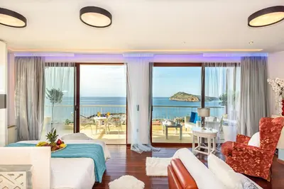 a living room with a view of the ocean at Blue Suite by Cosmos in Plataniás