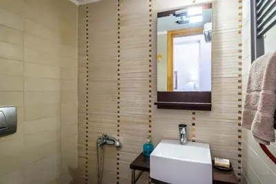 a bathroom with a sink and a mirror at Blue Suite by Cosmos in Plataniás
