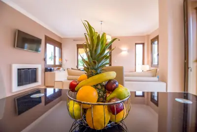 a bowl of fruit on a table in a living room at Casa Leone Suites in Stalos