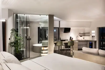 a kitchen and living room with a bed in a room at A-Loft Superior Experience in Chania Town