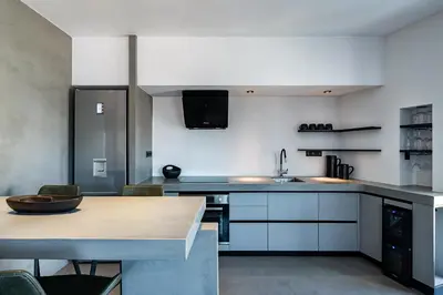 a kitchen with a counter and a table in it at A-Loft Superior Experience in Chania Town