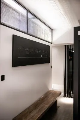 a room with a wooden bench on the wall at A-Loft Superior Experience in Chania Town
