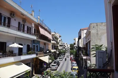a view of a city street with cars parked at Minaret's View ζήστε στην αύρα της παλιάς πόλης in Chania Town