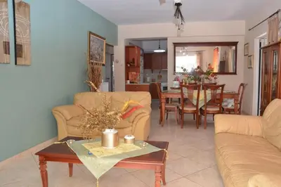 a living room with a couch and a table at Kostaspant apartment in Gerani Chanion