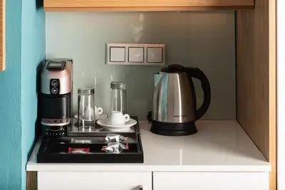 a kitchen with a coffee maker and a coffeemaker at Maleme Mare in Maleme