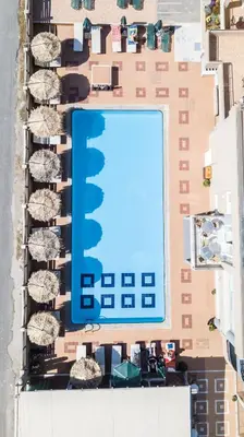an overhead view of a building with a swimming pool at Maleme Mare in Maleme