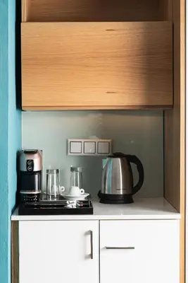 a kitchen with a stove and a tea kettle on a counter at Maleme Mare in Maleme
