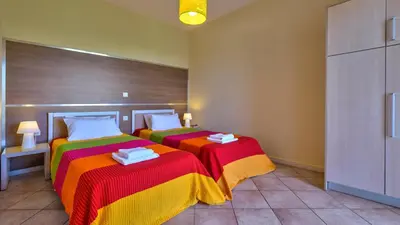 two beds in a room with two beds sidx sidx sidx sidx at Elea in Kato Daratso