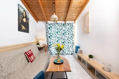 a living room with a couch and a table at Notus Chania Crete in Chania Town