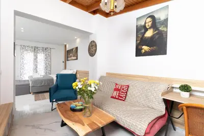 a living room with a couch and a table at Notus Chania Crete in Chania Town