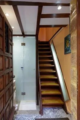 a staircase in a house with a glass door at Sali Chelidonaki boutique suite in Chania Town