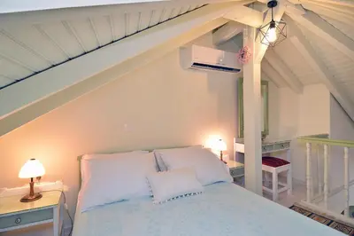 a bedroom with a bed in a room with an attic at Casa della Favola Boutique Hotel in Chania Town
