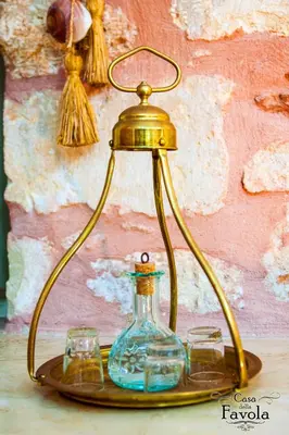 a brass lamp with two glasses on a tray at Casa della Favola Boutique Hotel in Chania Town