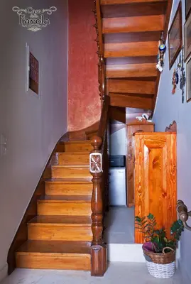a wooden staircase in a house with a stair case at Casa della Favola Boutique Hotel in Chania Town
