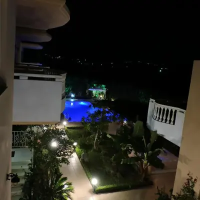 a view from the balcony at night at Golden Rose Suites in Kolymvari