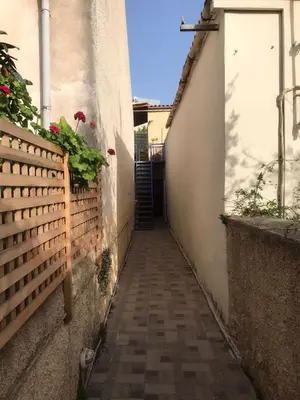 an alley with a stairway leading into a building at Cozy one-bedroom apartment in Halepa, Chania in Chania Town