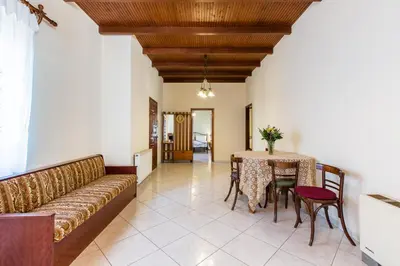 a living room with a couch and a table at Femina in Pírgos Psilonérou