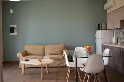 a living room with a couch and a table at Sofia's view Kissamos in Kissamos